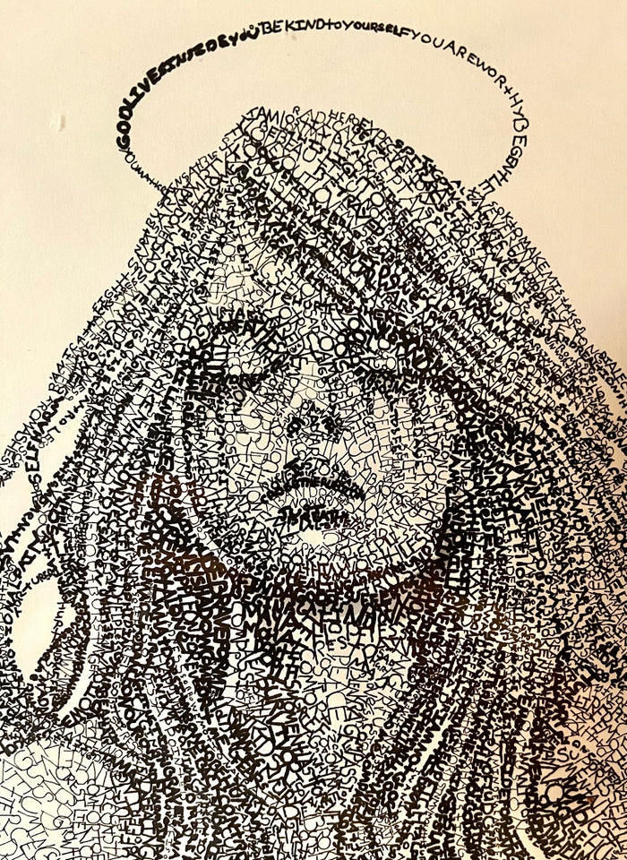 Close-up of the angel's face. It is made of handwritten words.
